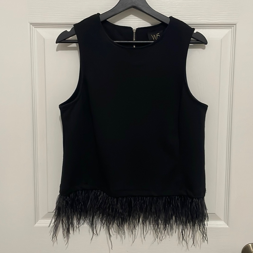 W5 women’s black top with a feathered hem